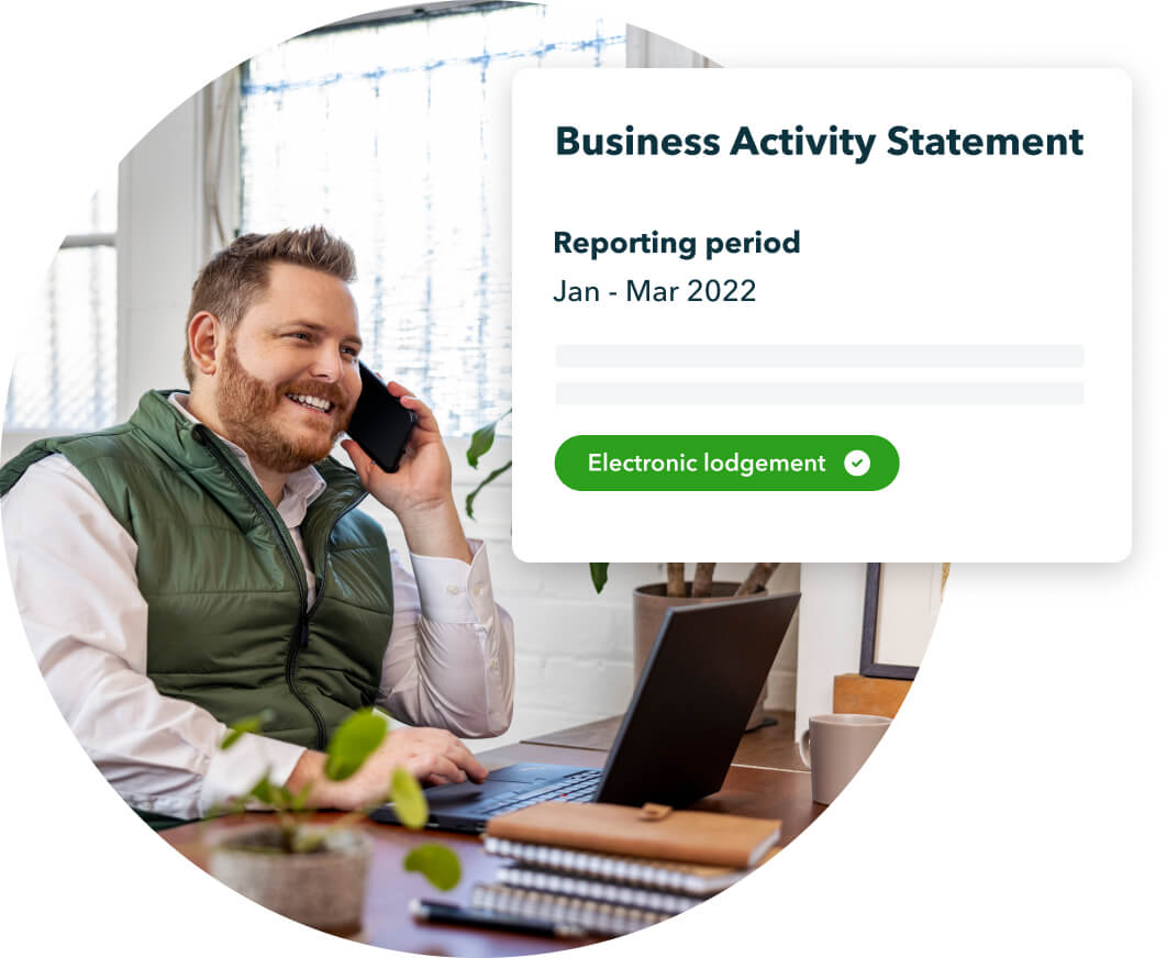 Accountant on a phone call while using a laptop, with a widget preview of QuickBooks Business Activity Statement feature